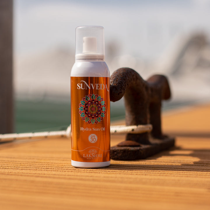Sunveda Hydra Sun Oil SPF 30 - Dry spray oil with sunflower flowers for face, body, and hair.