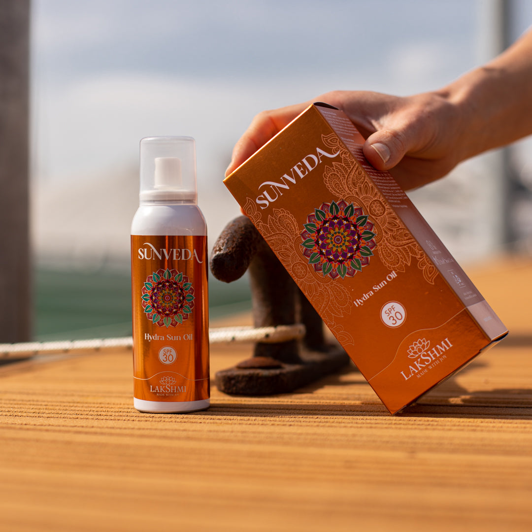 Sunveda Hydra Sun Oil SPF 30 - Dry spray oil with sunflower flowers for face, body, and hair.